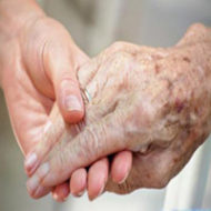 care giver holding hands